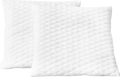 Two white quilted pillows are shown side-by-side against a white background.