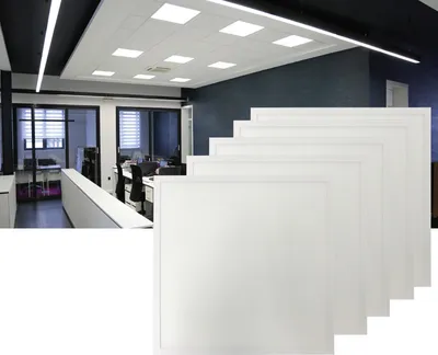 An office interior with ceiling lights and stacked LED panels in the foreground.