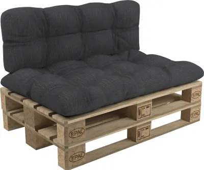 A dark gray cushion set on a wooden pallet.