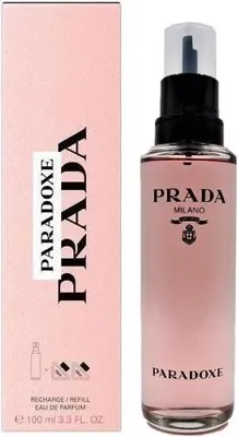 A pink box and a clear glass bottle of Prada Paradoxe perfume.