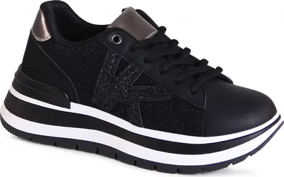 A studio shot of a single black sneaker with a platform sole.