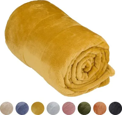 A rolled-up mustard yellow fleece blanket is shown against a white background. Below the blanket, there are several circular swatches of different colored blankets, indicating color options.