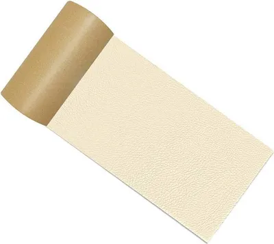 A roll of self-adhesive leather repair patch material in beige, with the backing paper partially peeled back.