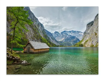 Produktbild von Wallario Herdabdeckplatte aus Glas, Größe 70 x 52 cm 2-teilig, Motiv Berghütte an See