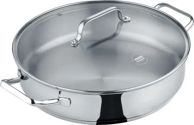 A stainless steel pan with a glass lid and handles, shown from a slightly elevated angle against a white background.
