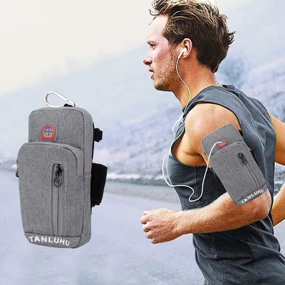Produktbild von Graues Sportarmband mit Telefonhalter und Passfach