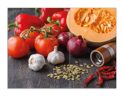 Produktbild von Wallario Herdabdeckplatte aus Glas, Größe 70 x 52 cm 2-teilig, Motiv Kürbissuppe - Zutaten mit Tomaten, Knoblauch, Zwiebeln und Pfeffer