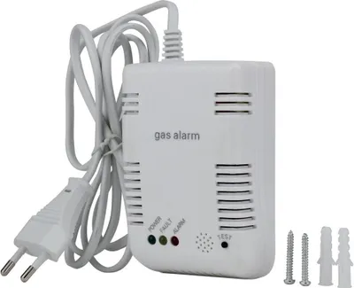 A white gas alarm device with a power cord and plug, along with screws and wall plugs.