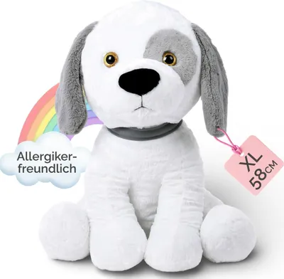 A plush toy dog sitting on a white background with a rainbow and cloud graphic.