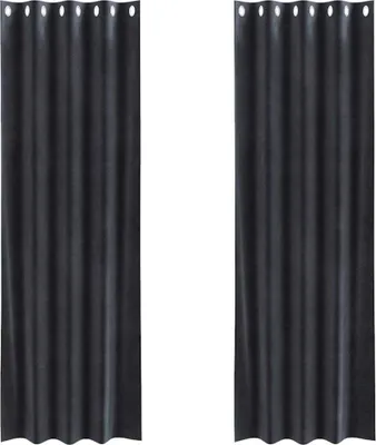 Two dark gray velvet curtains hanging side-by-side.