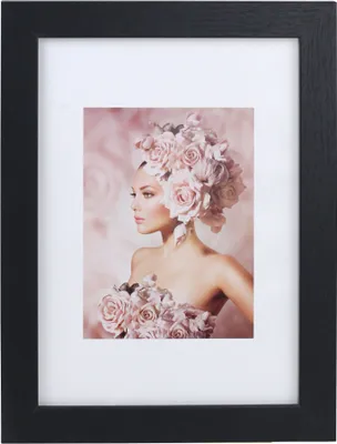A framed picture of a woman adorned with roses.