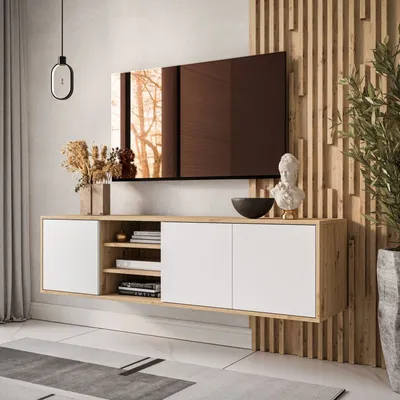 A modern living room with a wall-mounted TV cabinet and a large television.