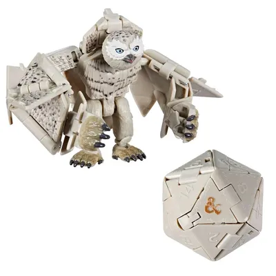 A toy owl-like creature and a D20 die are shown against a white background.