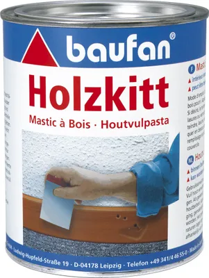 A can of wood filler (Holzkitt) with a hand applying it to wood.