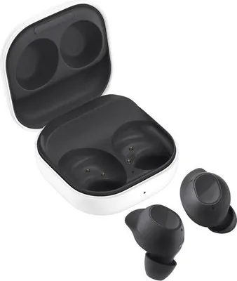 A pair of black wireless earbuds and their white charging case are displayed against a white background.
