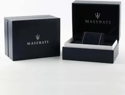 Two Maserati branded boxes, one closed and one open, displaying the Maserati logo and name.
