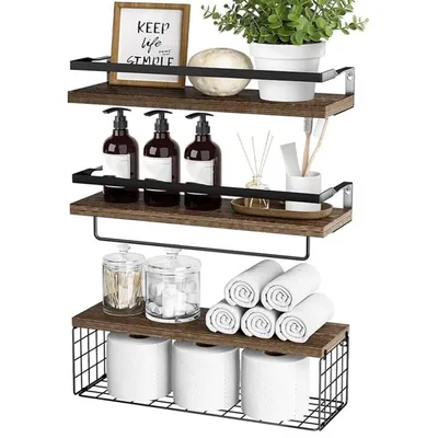 A set of three wooden shelves with black metal frames, displaying various bathroom and decorative items.