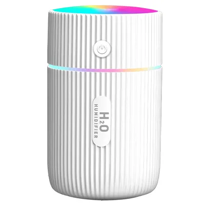 A white humidifier with colorful LED lights at the top.