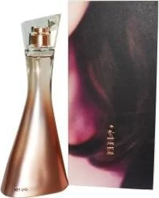 A perfume bottle and its box are displayed side-by-side against a white background.