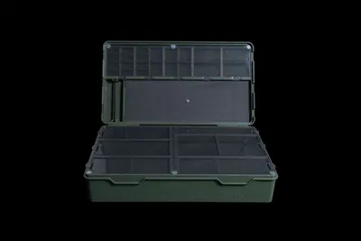 An open tackle box with multiple compartments, shown against a black background.