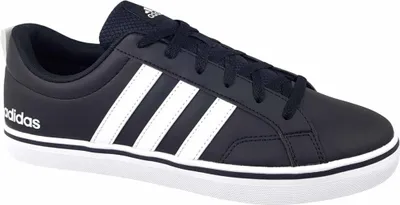 A side view of a navy blue Adidas sneaker with white stripes.