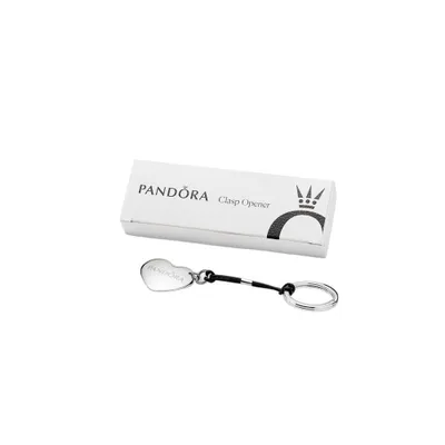 A Pandora clasp opener keychain in the shape of a heart, presented with its packaging box.