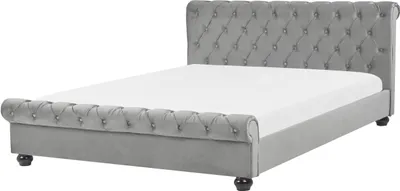 A grey upholstered bed frame with a tufted headboard and footboard, shown on a white background.