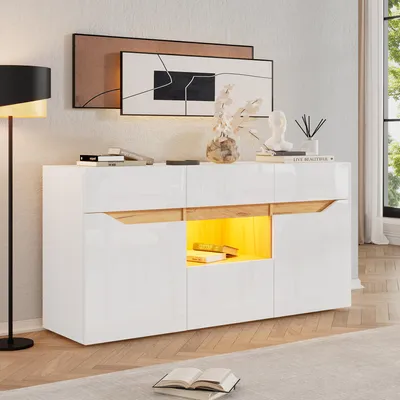 A modern living room scene featuring a white and wood sideboard with LED lighting.