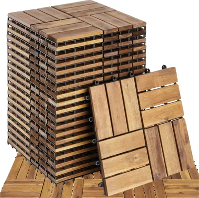 A stack of wooden deck tiles and a few loose tiles.