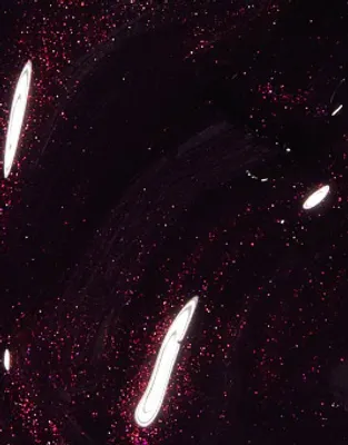 A close-up abstract view of a dark, glittery substance with streaks of white light.