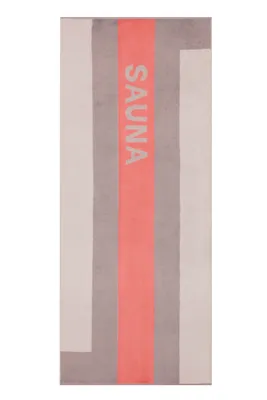A product shot of a sauna towel with a striped pattern and the word "SAUNA" printed vertically.