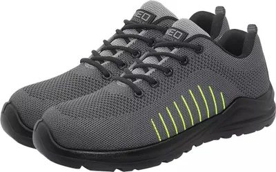 A pair of grey work shoes with black soles and laces, and yellow accents on the side.