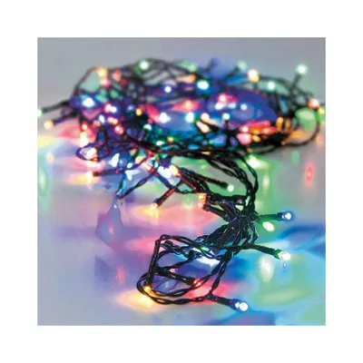 A tangled string of multicolored LED lights on a reflective surface.