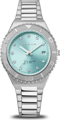 A close-up studio shot of a silver Bering watch with an aqua dial.