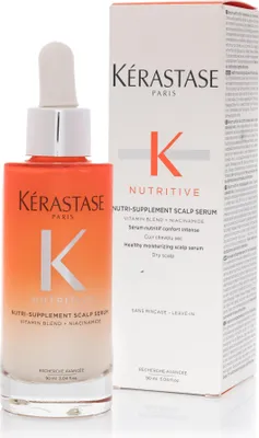 A bottle of Kérastase Nutritive Nutri-Supplement Scalp Serum next to its packaging.