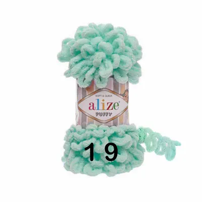 A ball of light turquoise yarn with loops, on a white background.