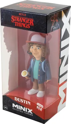 A collectible figurine of Dustin from Stranger Things in its packaging.