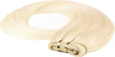 A bundle of blonde hair extensions is coiled on a white background.