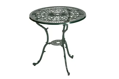 A green cast iron table on a white background.