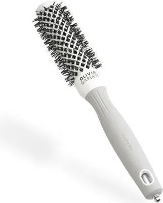 A professional studio shot of a round hairbrush.