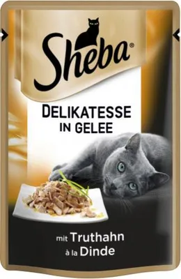 A pouch of Sheba cat food with a cat lying next to it.