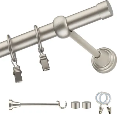 A curtain rod with rings and clips, along with some accessories.