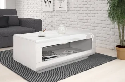 A modern living room scene with a white high-gloss coffee table as the focal point.