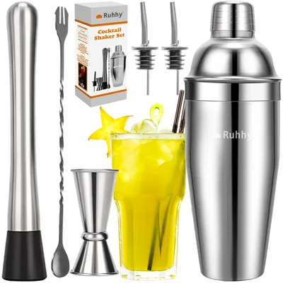 A cocktail shaker set with a drink and accessories on a white background.