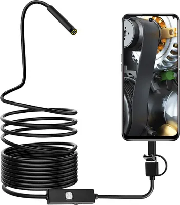 An endoscope camera connected to a smartphone displaying an engine belt.