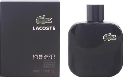 A black bottle of Lacoste Eau de Toilette and its matching black box are shown side-by-side against a white background.