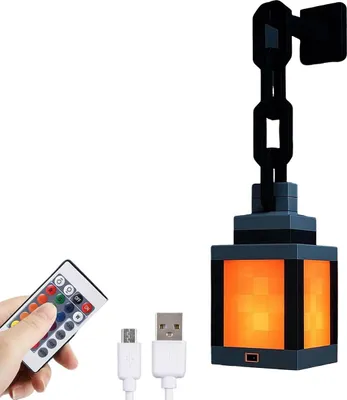 A hand holding a remote control next to a pixelated lantern light.