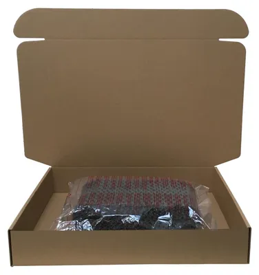 An open cardboard box containing a product wrapped in plastic.