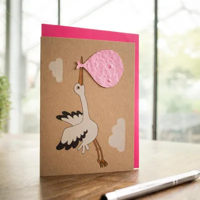 Produktbild von Geburtskarte Storch rosa Grußkarte Taufe oder Babyparty Postkarte Blumensamen