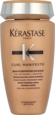 A bottle of Kerastase Curl Manifesto Gentle Hydrating Creamy Shampoo.
